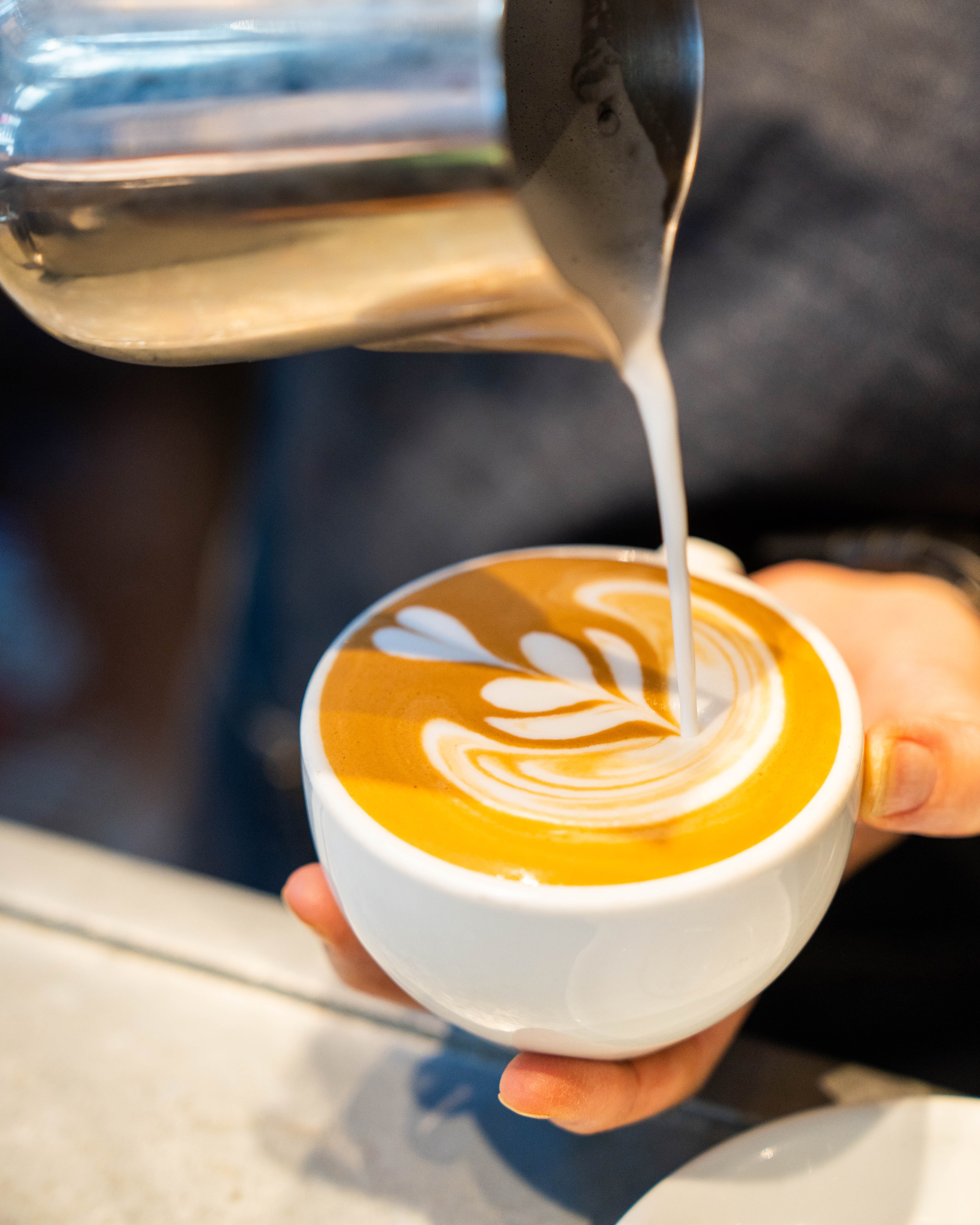 Barista creating latte art